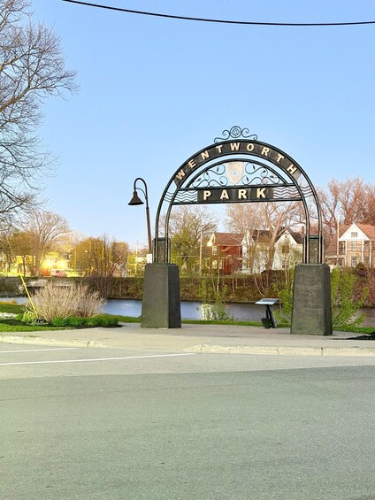 A park entrance sign with 'WENTWORTH PARK' written on it. 4