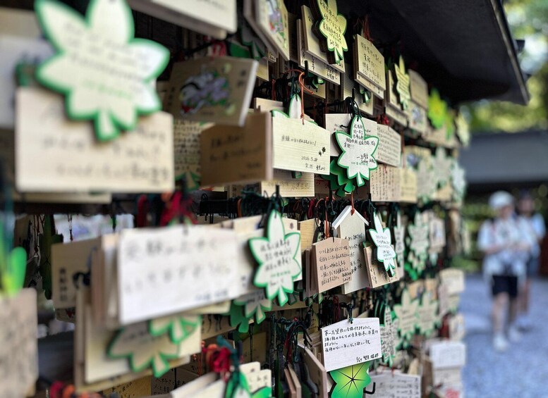 A wall of handwritten notes and cards, some with green decorations. 4
