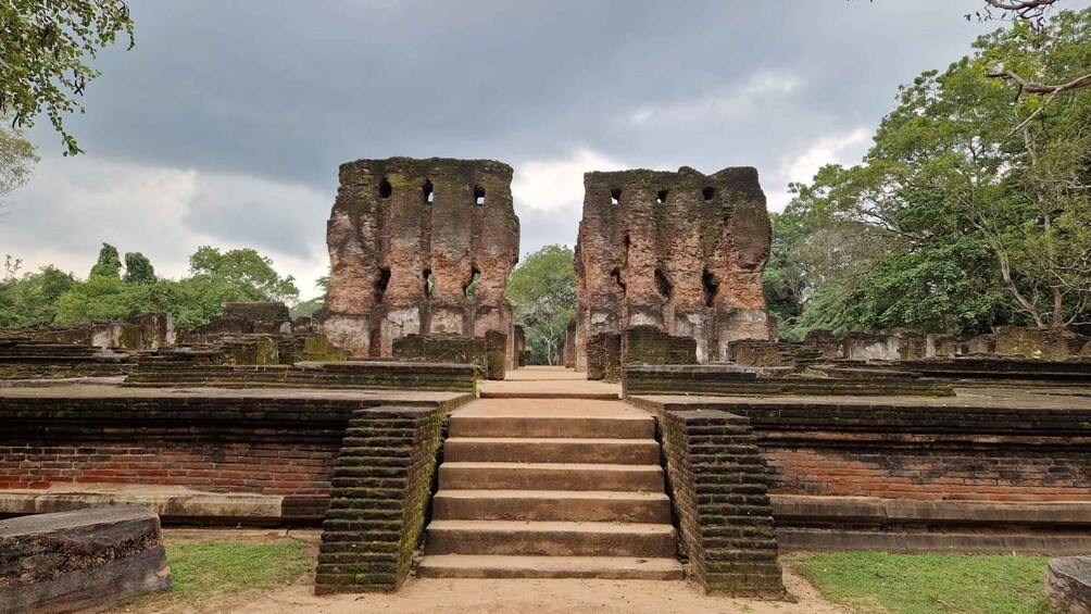Ancient brick ruins with a central staircase leading to a large doorway. 5