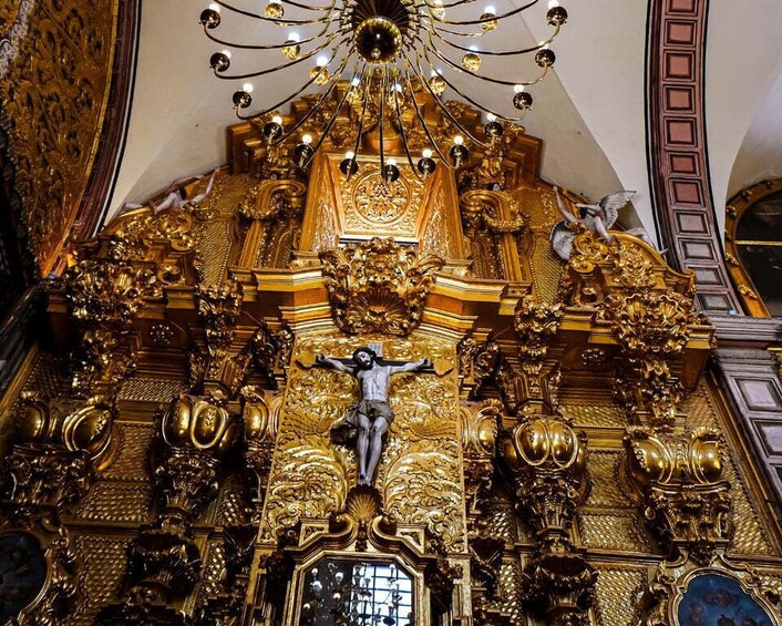 A golden altar with a crucifixion scene. 3
