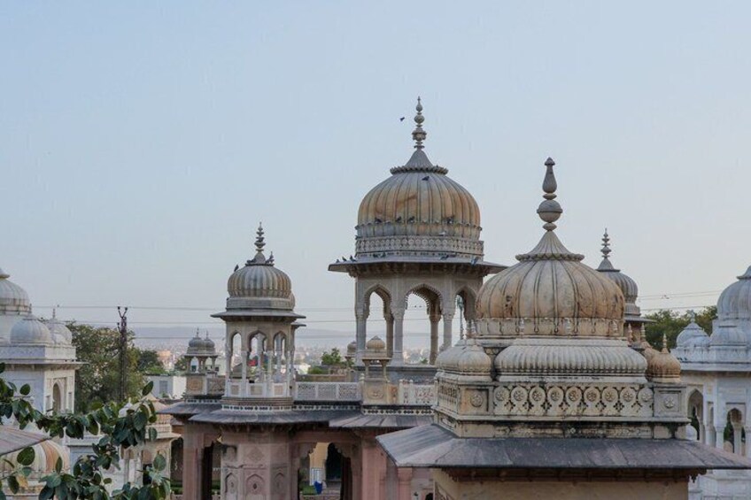 A collection of domed structures with intricate architectural details, likely part of a historical or religious complex. 2
