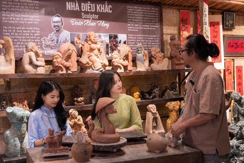 A pottery workshop with various clay sculptures and pottery items on display. 1