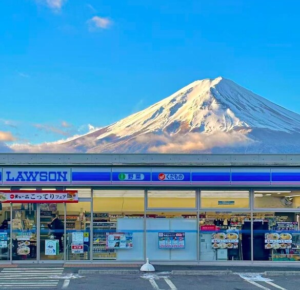 A Lawson convenience store with a view of Mount Fuji in the background. 5