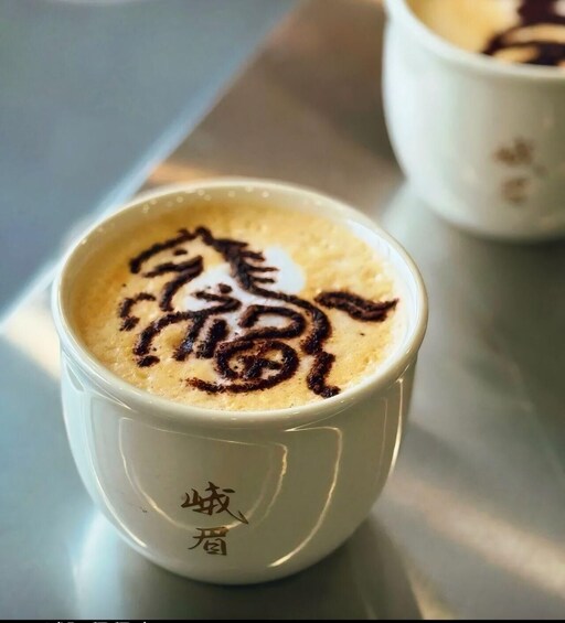 A cup of coffee with latte art. 5