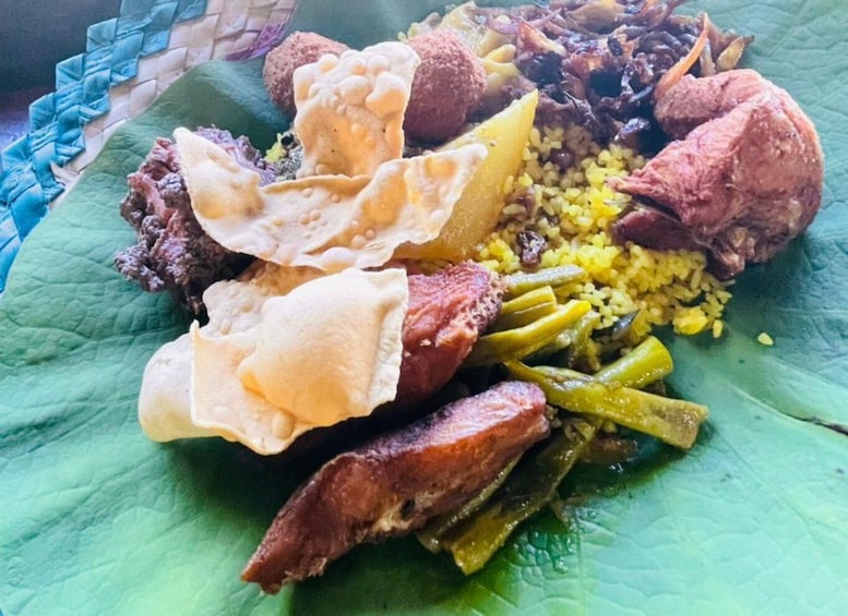 A plate of food with various dishes including rice, green beans, and meat. 1