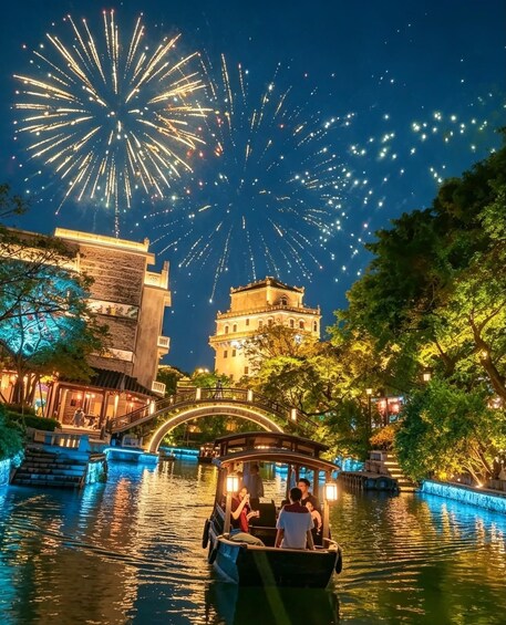 A boat on a river with fireworks in the sky. 1