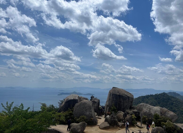 A mountainous landscape with large boulders and a clear sky. 4