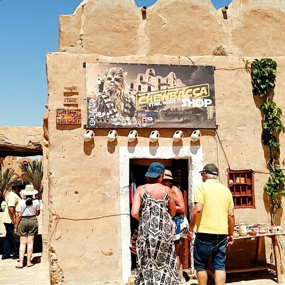 A shop with a Star Wars theme, including a sign and merchandise. 5
