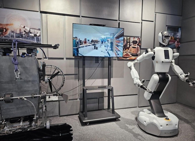 A robot interacting with a touchscreen display in a modern, industrial setting. 2