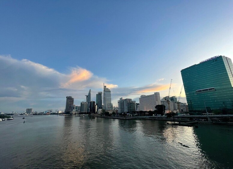 A city skyline with modern buildings, a body of water, and a clear sky. 5