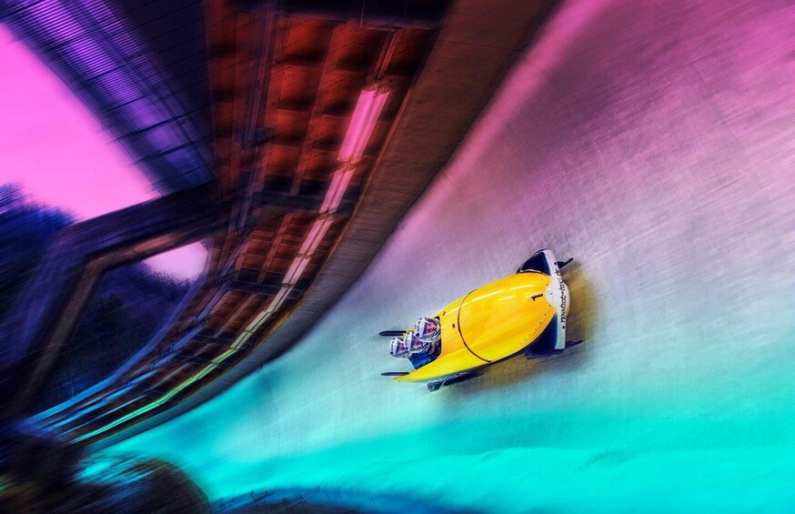 A yellow speedboat on a waterway, surrounded by a blurred background suggesting motion. 1