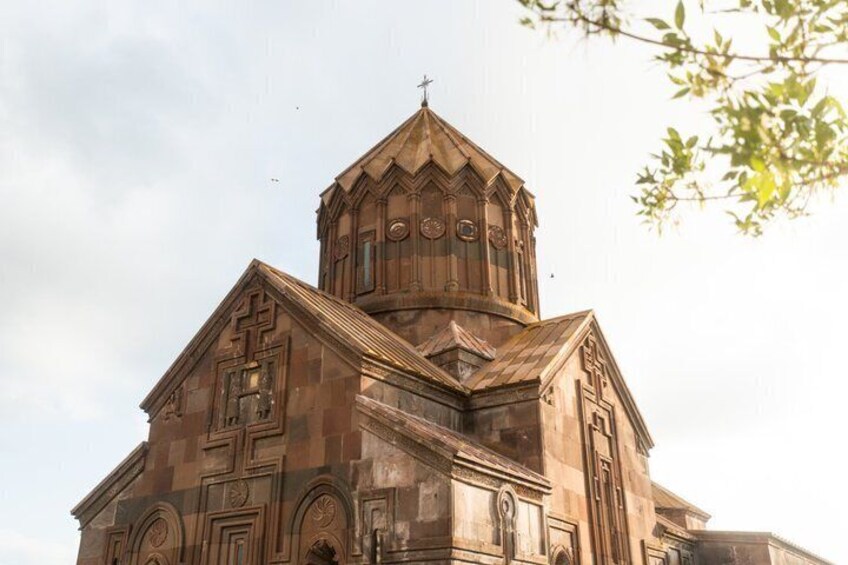 A church with a prominent bell tower and intricate stonework. 5