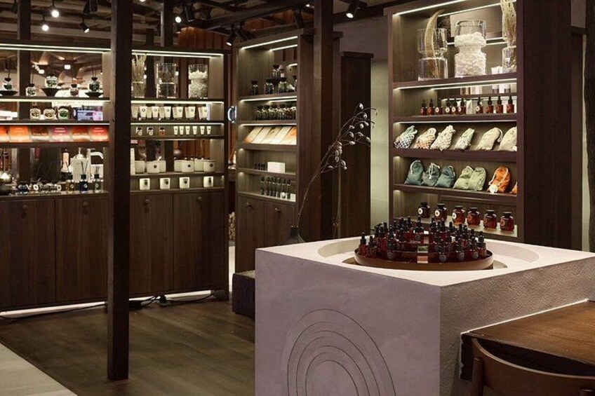 A store interior with wooden shelves displaying various items. 3