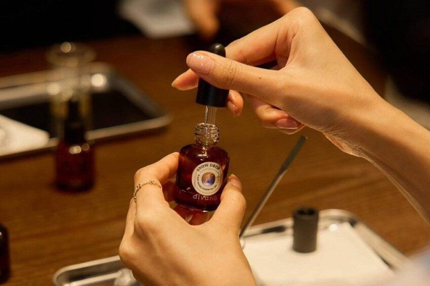 A person applying nail polish to another person's nails. 1