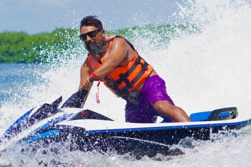 A person jet-skiing on a body of water. 3