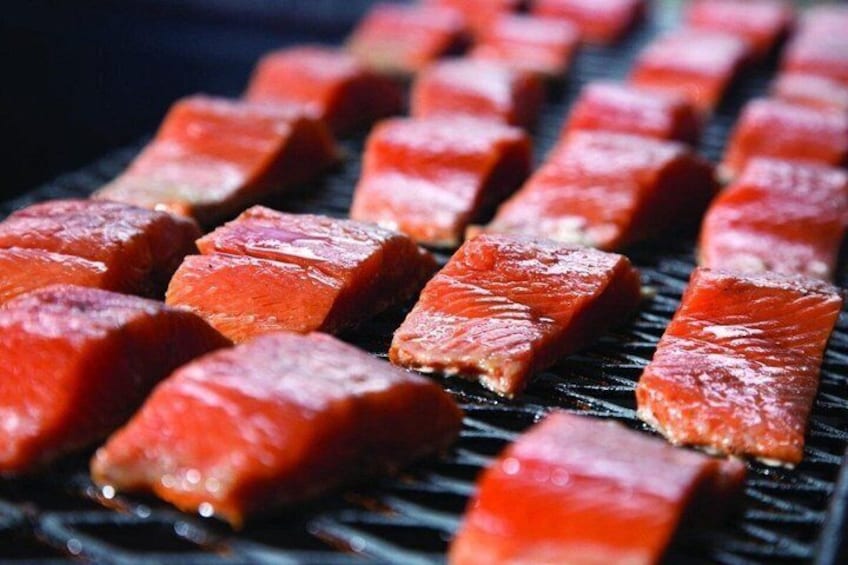 Grilled salmon pieces on a grill. 1