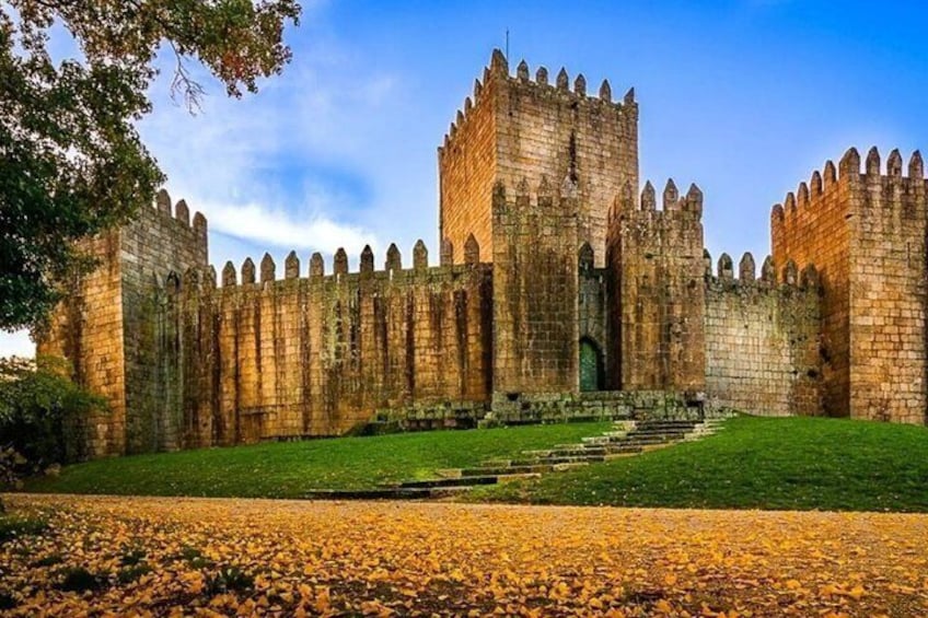 A historic castle with tall stone walls and a central tower. 1