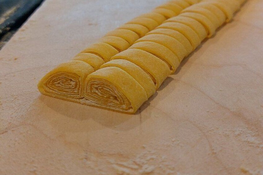 A rolled pastry on a floured surface. 3