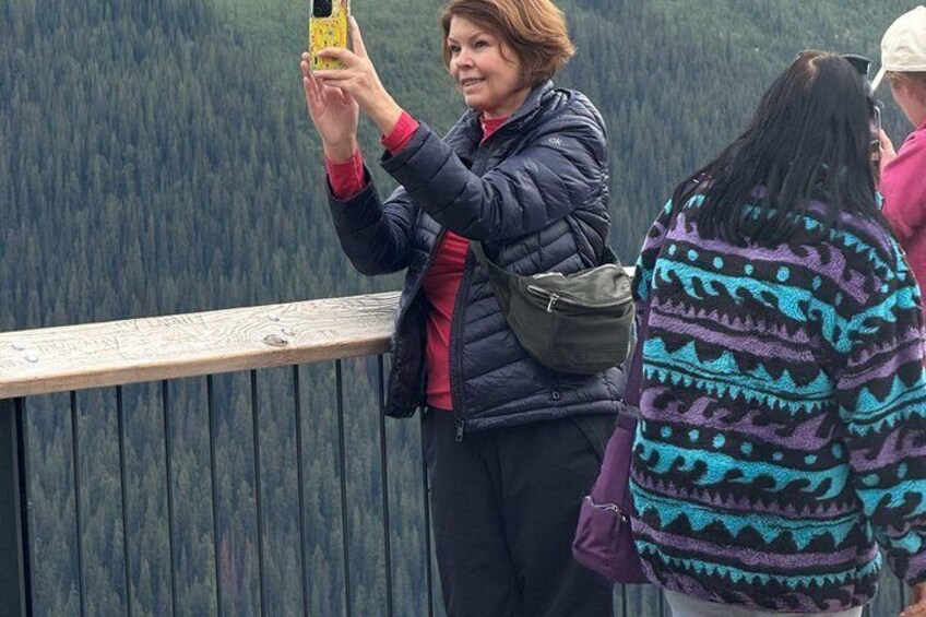 A person taking a photo with a smartphone. 5