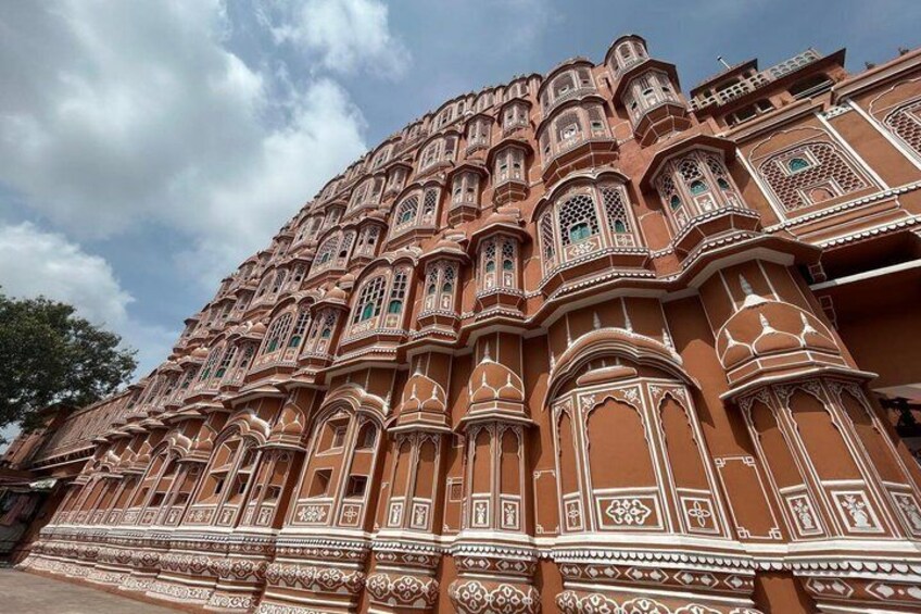 A large, ornate building with intricate architectural details and multiple windows. 4