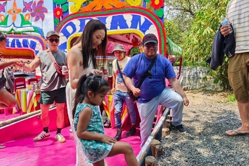 A colorful amusement ride with people enjoying it. 1
