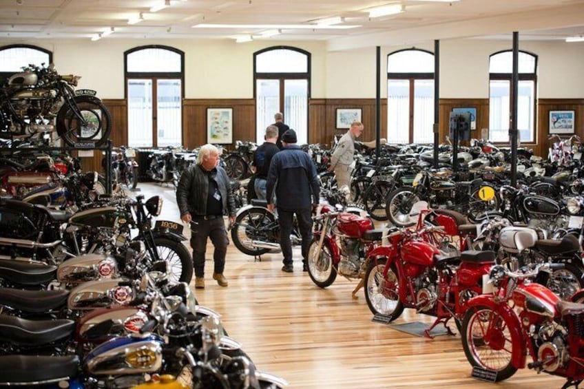 A showroom with various motorcycles on display. 1
