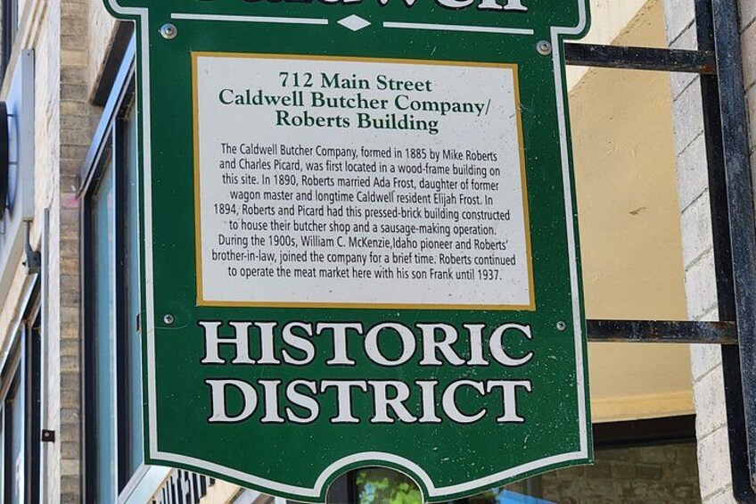A historic district sign with information about the Caldwell Butcher Company/Roberts Building at 712 Main Street. 5