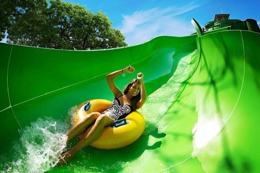 A person on a yellow water slide. 3