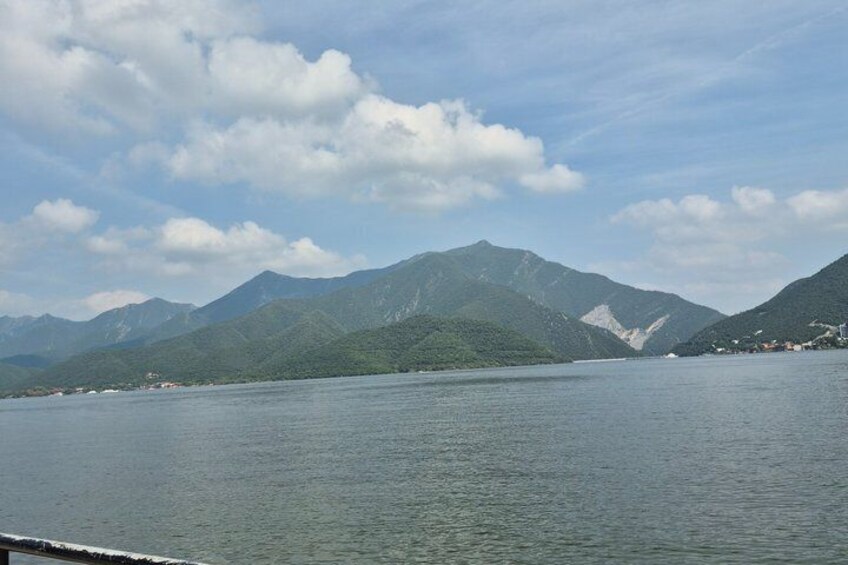 A lake with mountains in the background. 3