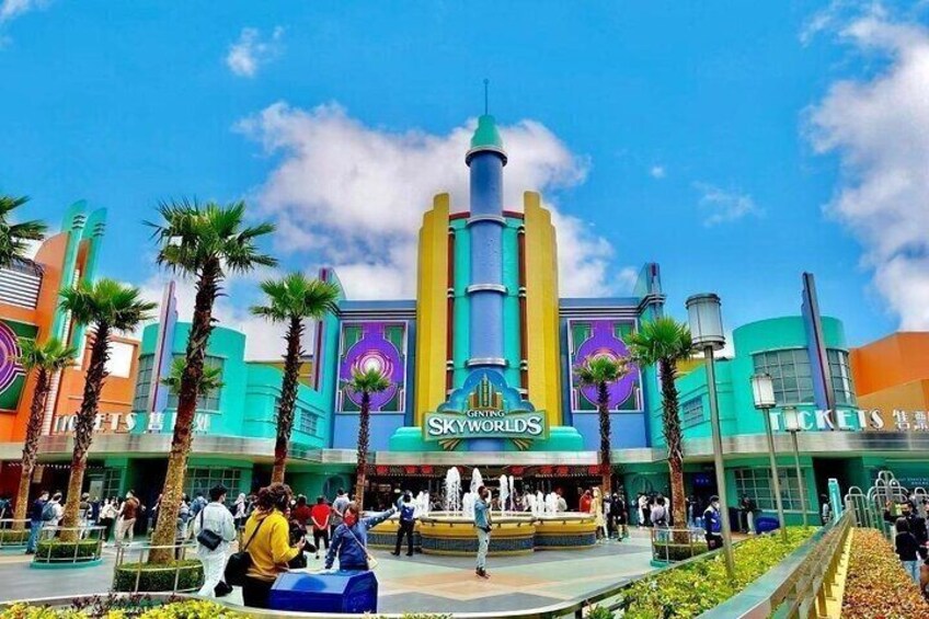 A colorful building with a prominent sign reading 'SkyWorlds' and a ticket booth. 1