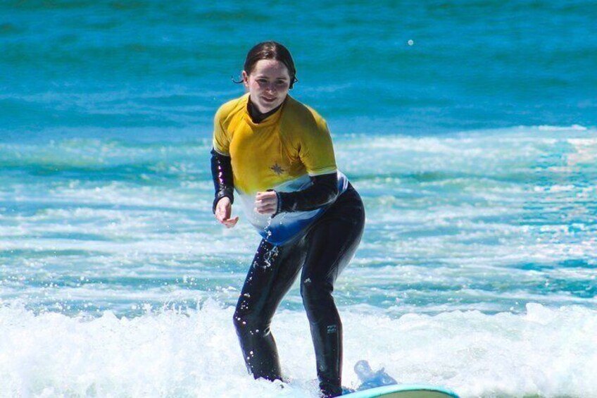 A person surfing on a wave in the ocean. 5