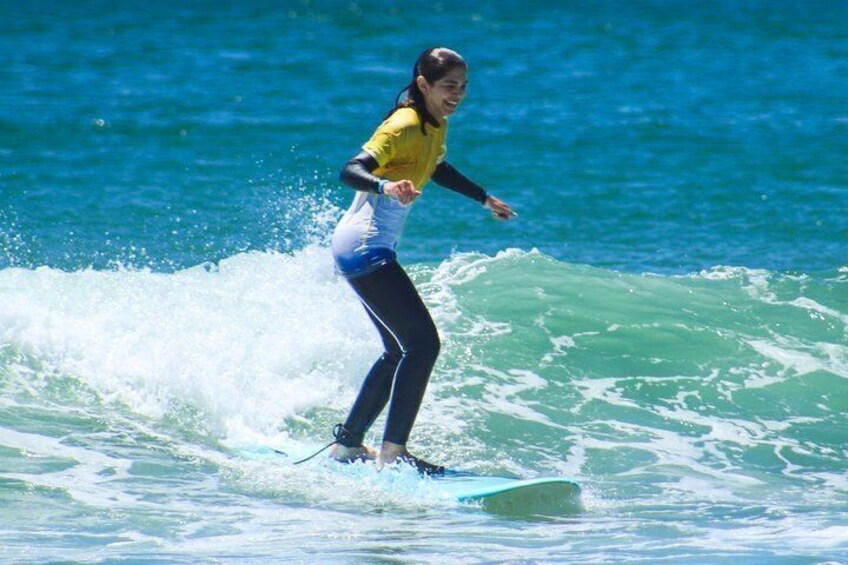 A person surfing on a wave in the ocean. 3