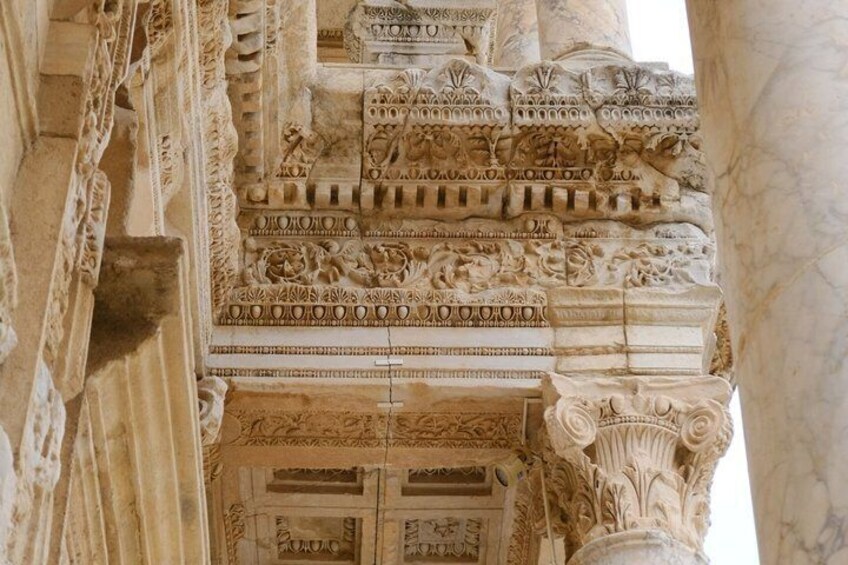 Detailed stone carvings and columns of an ancient structure. 3