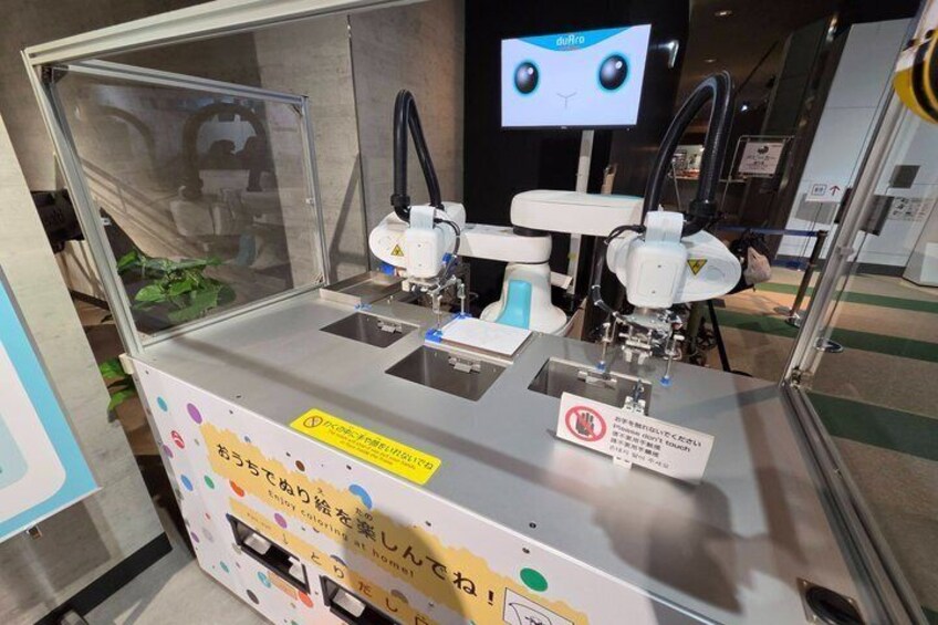 A medical device with a monitor, a sign with Japanese text, and a caution sign. 4