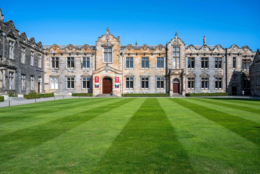 A historic building with a symmetrical facade, large windows, and a central entrance. 4