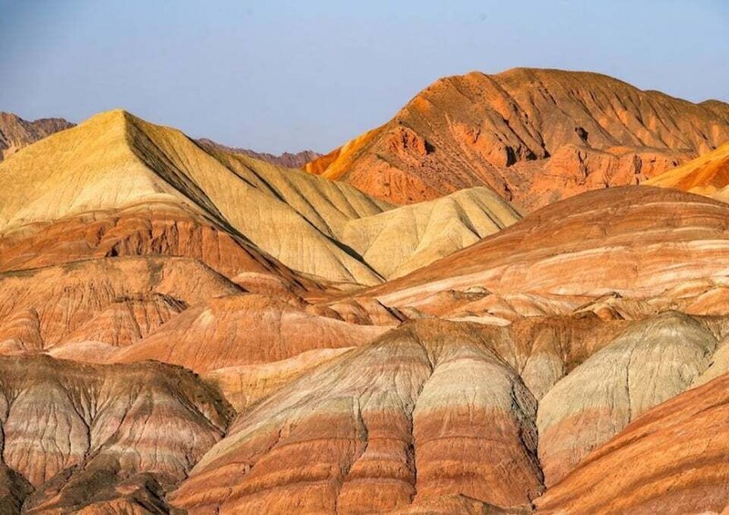 Layered rock formations with varying colors and textures. 4