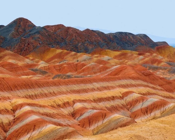 A colorful landscape with layered rock formations. 3