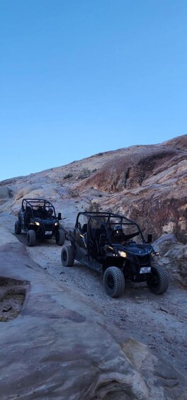 Two off-road vehicles on a rocky trail. 5