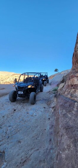 A 4x4 vehicle navigating a rocky terrain. 1