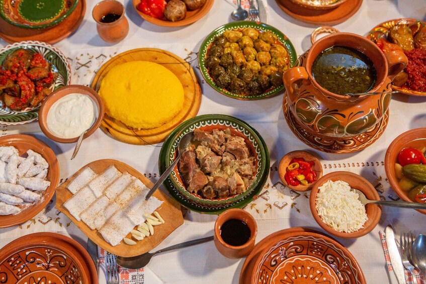 A variety of traditional dishes and pottery on a table. 1