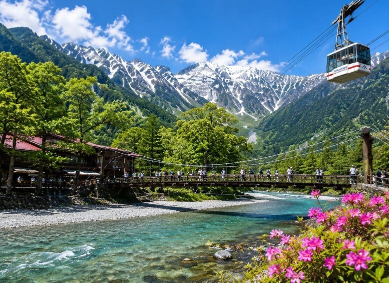 A suspension bridge over a clear river, surrounded by lush greenery and snow-capped mountains. 1