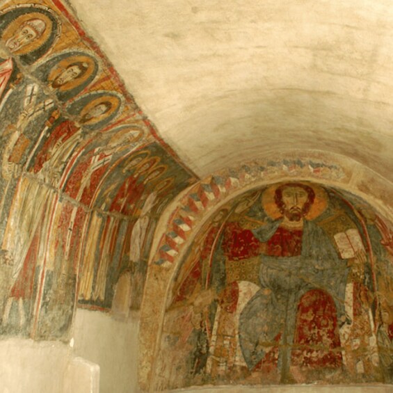 A mosaic with religious figures and architectural details. 4