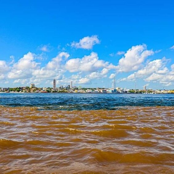 A coastal cityscape with a clear sky and calm sea. 3
