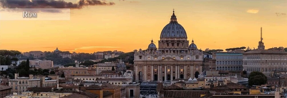 A cityscape with a prominent domed building, likely a cathedral, during sunset. 1
