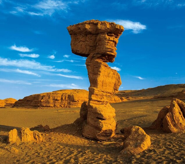 A rock formation in a desert landscape. 4