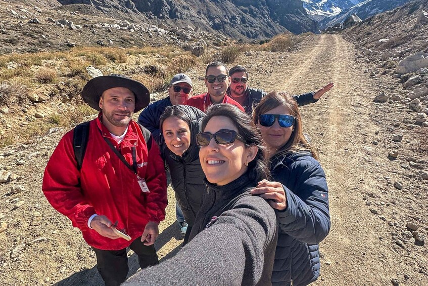 A group of people on a rocky mountain trail. 4