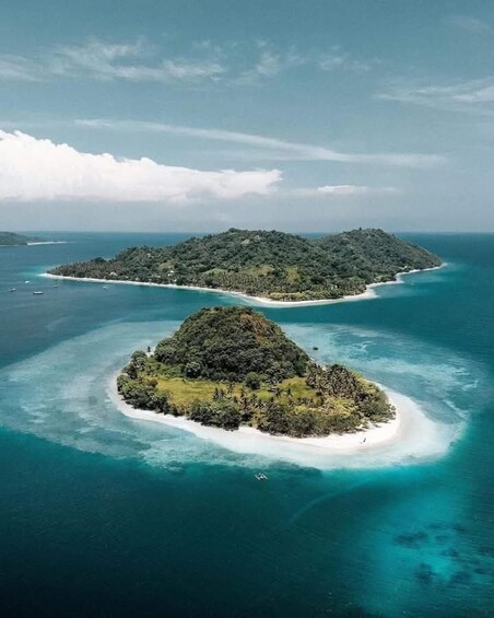 Two small islands surrounded by turquoise waters. 3
