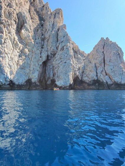 A rocky coastline with clear blue water. 4