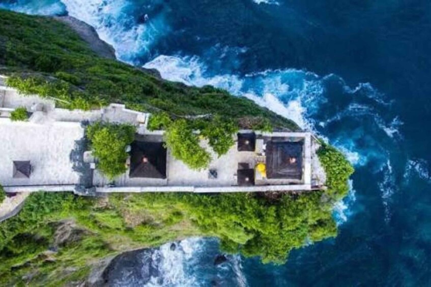 A coastal cliffside with a stone structure overlooking the ocean. 5