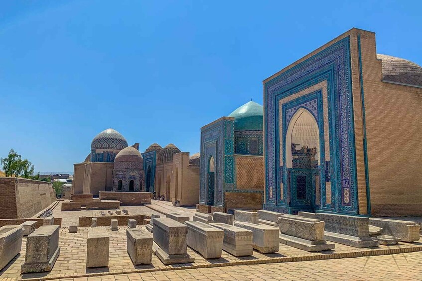 A historical site with domed structures and intricate tile work. 1